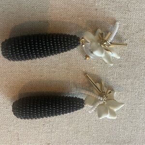 Black Beaded Earrings with White Floral Accent